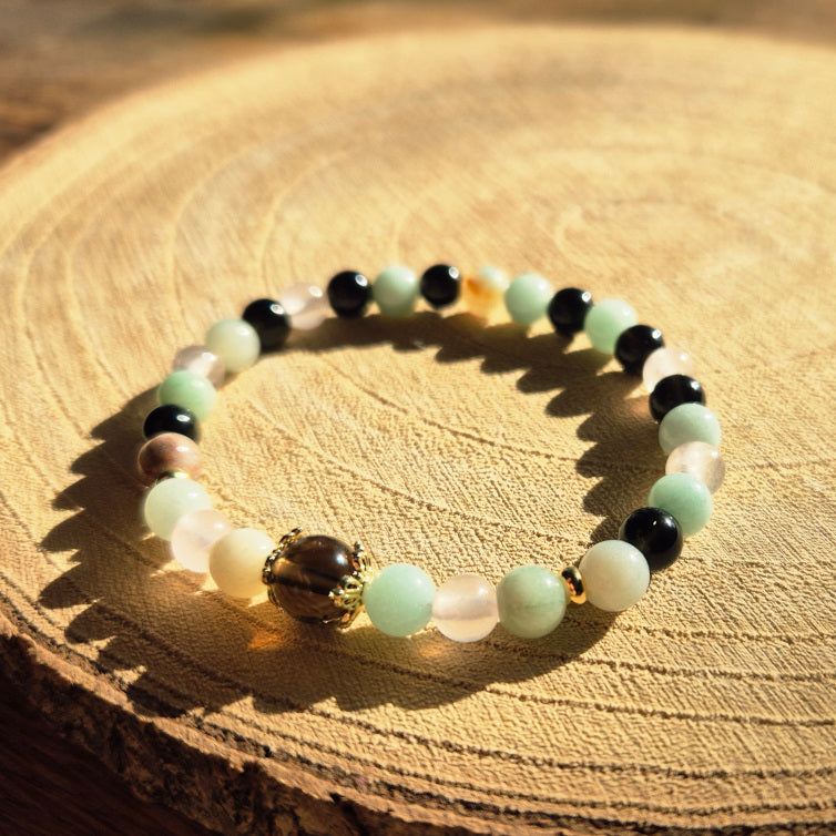Bracelet protecteur en Obsidienne Noire, Amazonite et Quartz Fumé — aide à poser les limites et à rester centré avec douceur.