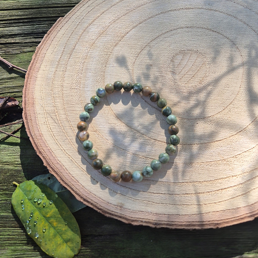 Bracelet en perles de 6 mm en rhyolite naturelle d’Australie, pierre de créativité, de renouveau et d’équilibre émotionnel.